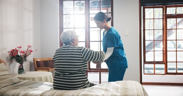 activities-caregiver-assisting-elderly-patient-home